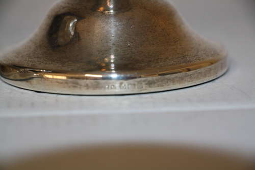 A pair of dwarf candle sticks.8cm ht 8cm wide.Total weight of 240grams