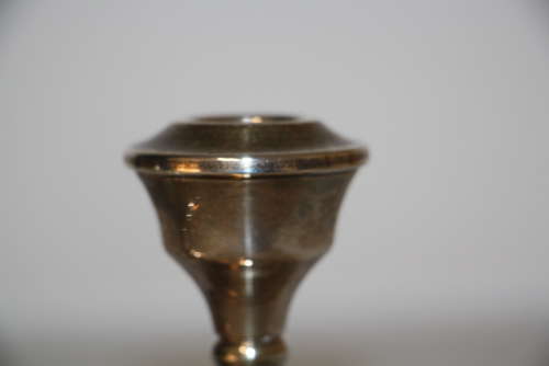 A pair of dwarf candle sticks.8cm ht 8cm wide.Total weight of 240grams