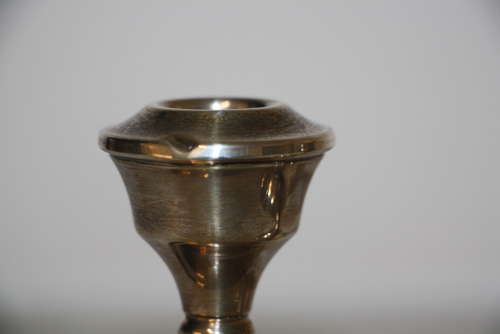 A pair of dwarf candle sticks.8cm ht 8cm wide.Total weight of 240grams