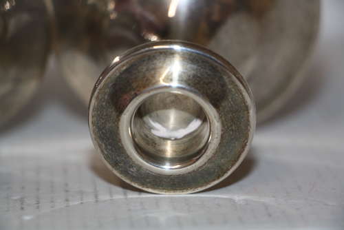 A pair of dwarf candle sticks.8cm ht 8cm wide.Total weight of 240grams