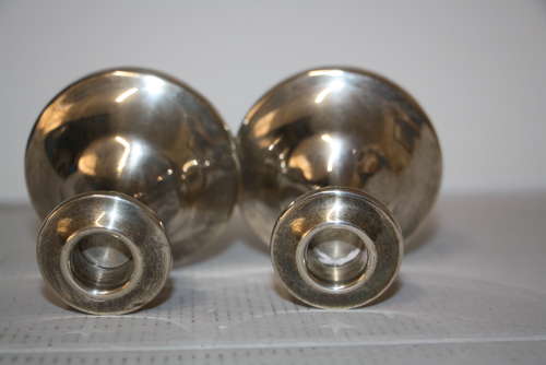 A pair of dwarf candle sticks.8cm ht 8cm wide.Total weight of 240grams