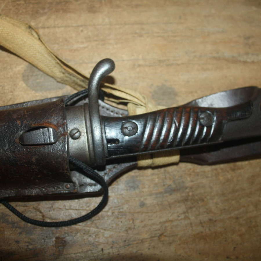 A WW1 GERMAN SAWBACK BUTCHER BAYONET.WITH ORIGINAL FROG AND KNOT.