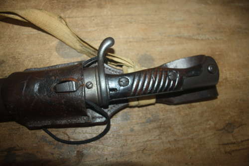 A WW1 GERMAN SAWBACK BUTCHER BAYONET.WITH ORIGINAL FROG AND KNOT.