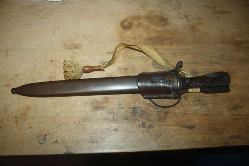 A WW1 GERMAN SAWBACK BUTCHER BAYONET.WITH ORIGINAL FROG AND KNOT.
