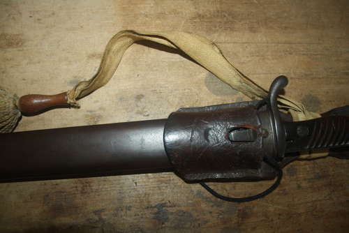 A WW1 GERMAN SAWBACK BUTCHER BAYONET.WITH ORIGINAL FROG AND KNOT.