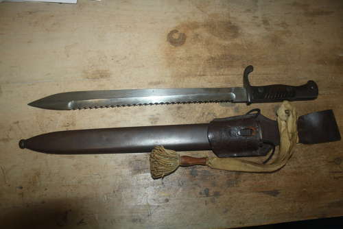 A WW1 GERMAN SAWBACK BUTCHER BAYONET.WITH ORIGINAL FROG AND KNOT.