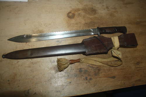 A WW1 GERMAN SAWBACK BUTCHER BAYONET.WITH ORIGINAL FROG AND KNOT.
