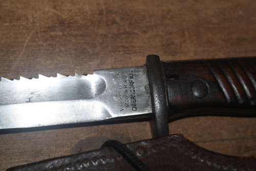 A WW1 GERMAN SAWBACK BUTCHER BAYONET.WITH ORIGINAL FROG AND KNOT.