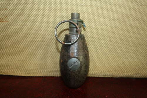 A WW1 BRITISH NO34 GRANADE DATED 1917.