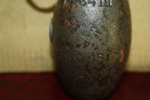 A WW1 BRITISH NO34 GRANADE DATED 1917.