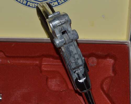 A LONE STAR BOXED LUGER WEAR WITH AGE COMPLETE.