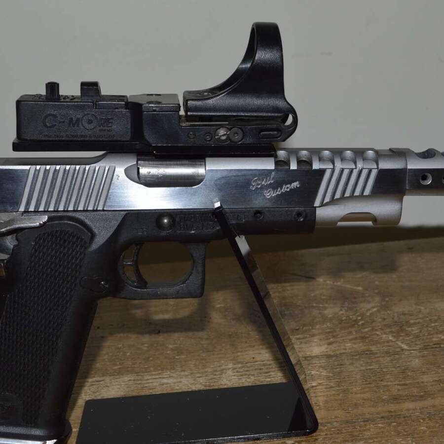 A CASED 9MM PARA BUL CUSTOM M5 RACE GUN. WITH 3 SPARE MAGS.
