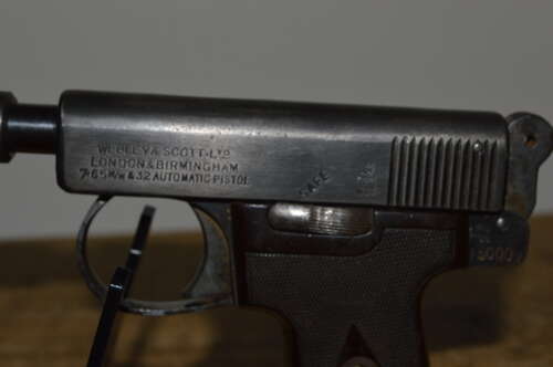 A .32 WEBLEY AUTO PISTOL. FITTED WITH A DUMMY SILENCER. EU DEACT.