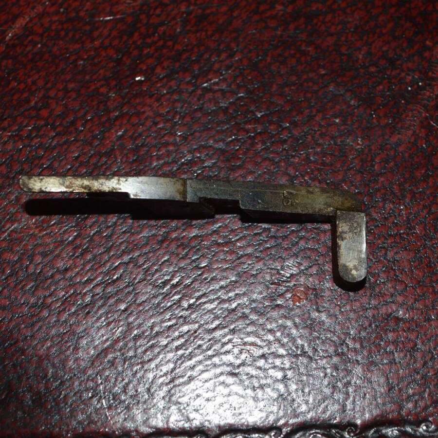 A ORIGINAL WW1 LUGER HOLD OPEN DEVICE WITH ITS SPRING.