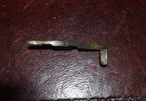 A ORIGINAL WW1 LUGER HOLD OPEN DEVICE WITH ITS SPRING.