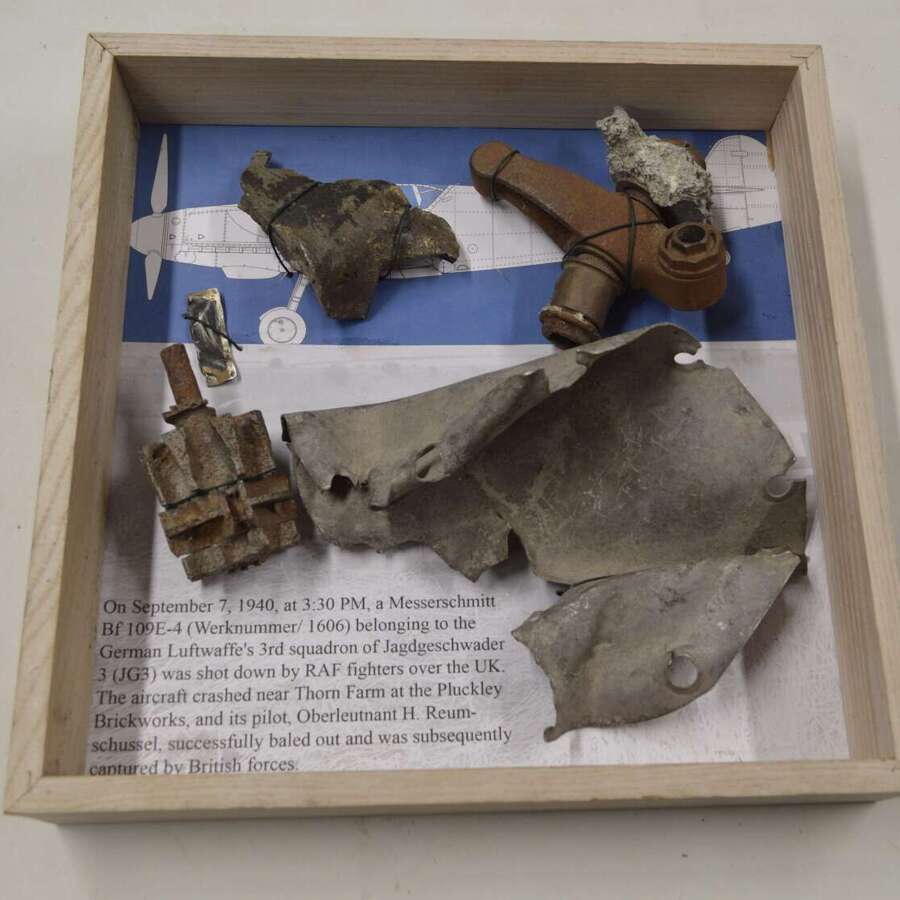 A GOOD SELECTION OF GERMAN WW2 MESSERSCHMITT PARTS ON A FRAME.SHOT DOWN BY RAF SEPT 1940.