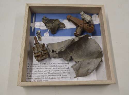 A GOOD SELECTION OF GERMAN WW2 MESSERSCHMITT PARTS ON A FRAME.SHOT DOWN BY RAF SEPT 1940.
