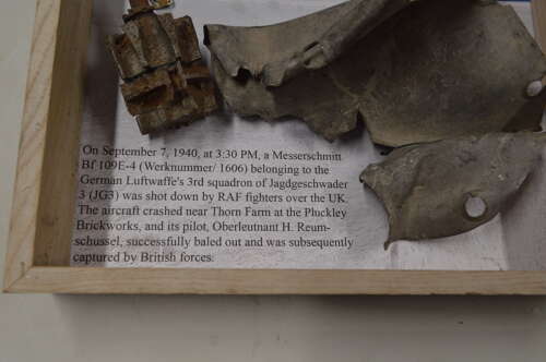 A GOOD SELECTION OF GERMAN WW2 MESSERSCHMITT PARTS ON A FRAME.SHOT DOWN BY RAF SEPT 1940.