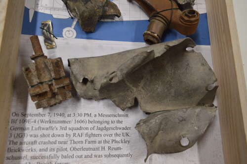 A GOOD SELECTION OF GERMAN WW2 MESSERSCHMITT PARTS ON A FRAME.SHOT DOWN BY RAF SEPT 1940.