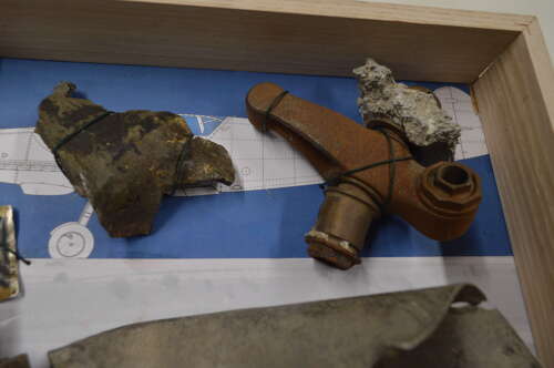 A GOOD SELECTION OF GERMAN WW2 MESSERSCHMITT PARTS ON A FRAME.SHOT DOWN BY RAF SEPT 1940.