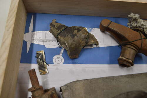 A GOOD SELECTION OF GERMAN WW2 MESSERSCHMITT PARTS ON A FRAME.SHOT DOWN BY RAF SEPT 1940.