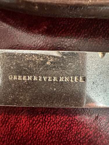 A 19th century green river hunting knife. In leather scabbard.