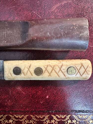 A 19th century green river hunting knife. In leather scabbard.