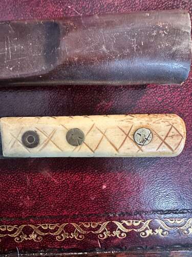 A 19th century green river hunting knife. In leather scabbard.